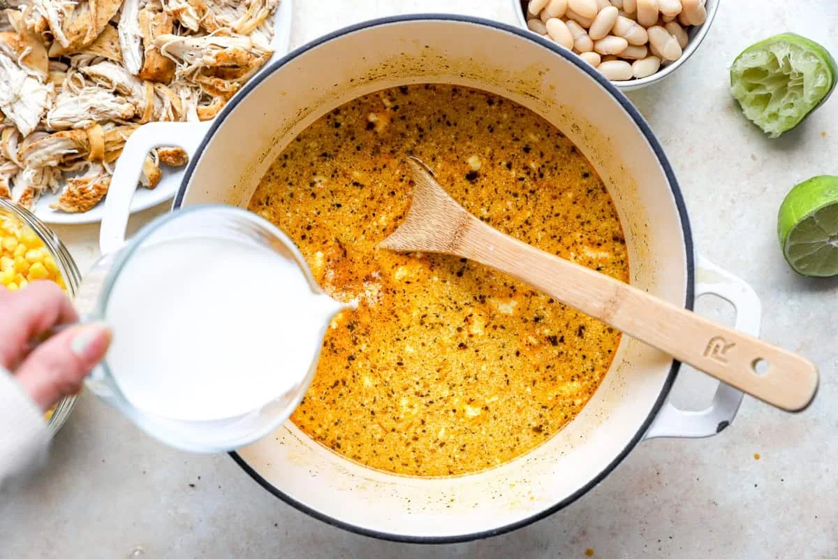 adding corn and cannellini beans to street corn chicken chili