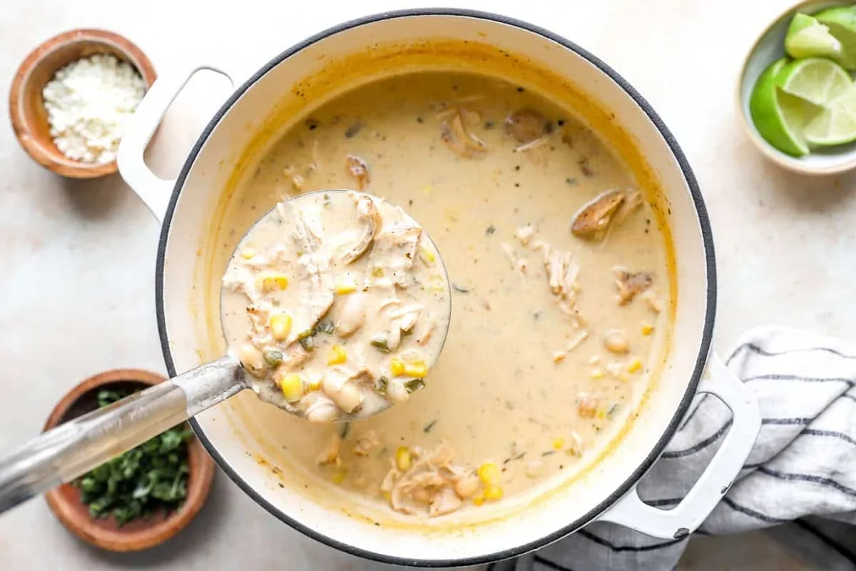 bowls of street corn white chicken chili with toppings